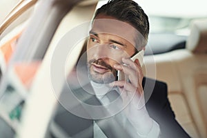 Businessman, travel and talking with phone call in car for commute, conversation or communication. Man or employee on