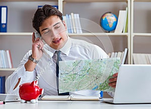 The businessman traveling agent working in the office