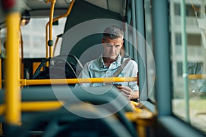 Businessman traveling by bus