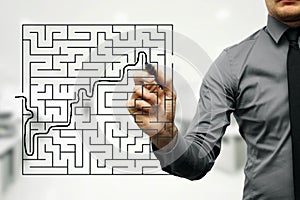 businessman trying to find way out of maze