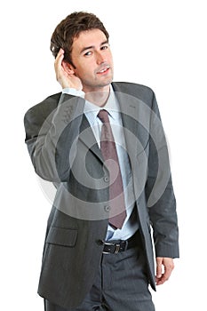 Businessman trying to hear valuable information