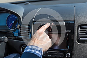 Businessman turn on car emergency stop button driving on the highway.