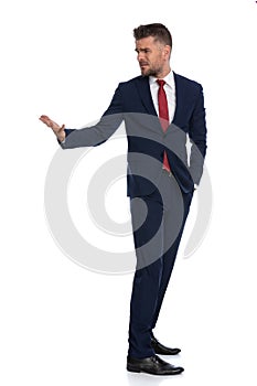 Businessman turning around and asking for explanations