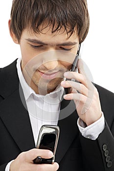 Businessman with two cellular phones