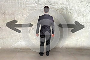 Businessman between two different choices