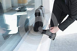 Businessman Tying His Shoes