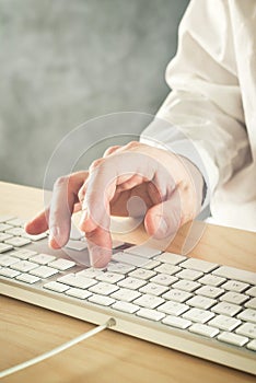 Businessman typing on his camputer