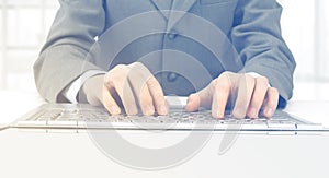 businessman, typing on his laptop