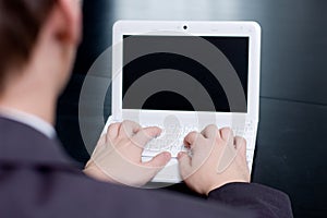 Businessman typing on his notebook