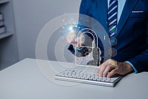 Businessman typing on keyboard with encrypted hologram for business management sign, encryption to secure sensitive data, password