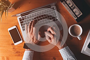 Businessman typing laptop computer keyboard, overhead shot