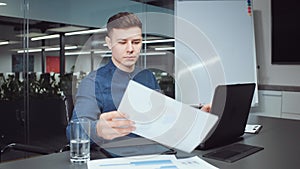 Businessman typing on laptop in office