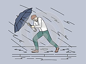 Businessman with umbrella protect from storm