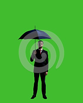 Businessman with umbrella standing over chroma key background. Business, career job concept.
