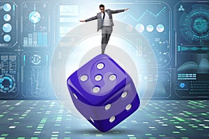 Businessman in uncertainty concept with dice