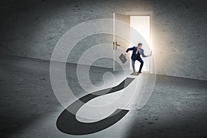 The businessman in uncertainty and question concept