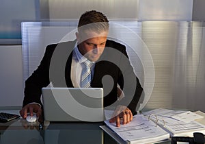 Businessman under pressure working overtime