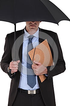 Businessman under an umbrella