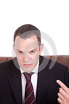 Businessman upset seated on a chair