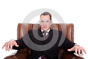 Businessman upset seated on a chair