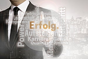 Businessman with urban background Erolg in german success word