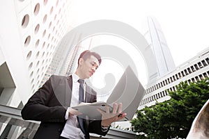 Businessman use computer in honkong