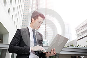 Businessman use computer in honkong