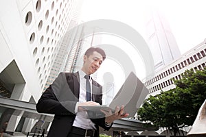 Businessman use computer in honkong