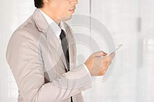 Businessman use a smartphone in office.