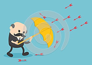Businessman use umbrella protecting arrow