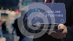 Businessman uses hologram Online Studying
