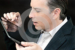 Businessman Uses Tablet, Side Profile