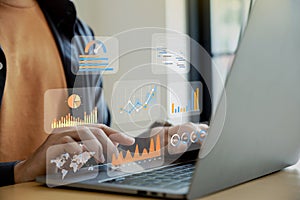 Businessman using analytics data KPI dashboard tech on virtual screen