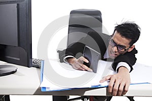 Businessman using calculator