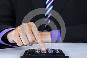 Businessman using a calculator