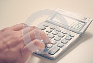 Businessman using a calculator