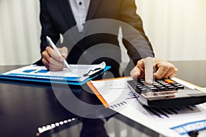 Businessman using a calculator to calculate financial accounts