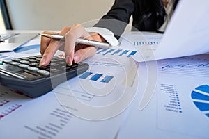 Businessman using calculator to calculate loan plan