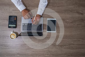 businessman using a calculator top view, calculating user expenses, budgeting, and loan accounting