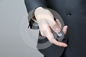 Businessman using car key