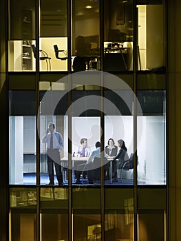 Businessman Using Cellphone In Conference Room