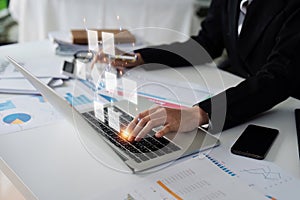 Businessman using a computer analysis for process and workflow automation with flowchart