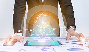 Businessman using concept tablet data graph analysis With modern