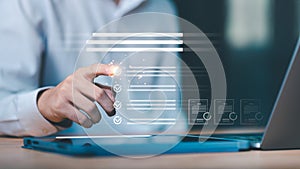 A businessman using a digital interface to check tasks on a virtual checklist, symbolizing workflow management, document approval