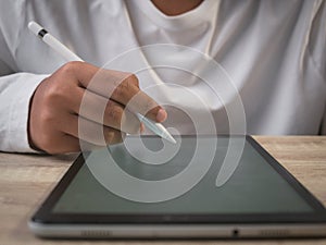 Businessman using digital pen for digital tablet for Online working, E-learning