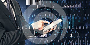 Businessman using digital tablet with abstract data and virtual analytics background