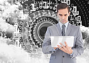 Businessman using digital tablet with binary codes and cloud in background