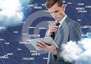 Businessman using digital tablet with connecting icons against blue background with clouds