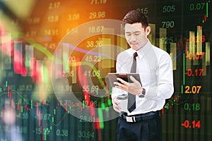 Businessman Using Digital Tablet on digital stock market financial exchange information and Trading graph background