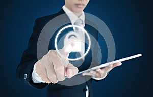 Businessman using digital tablet and pressing lock icon on screen. Security system concept